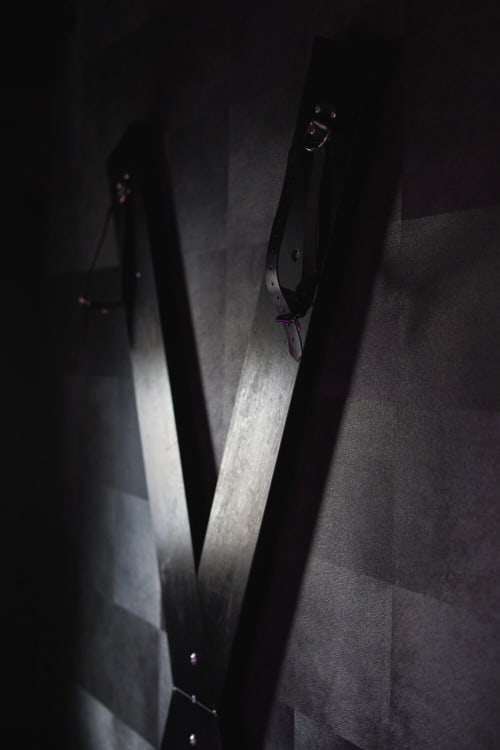 Dark atmospheric corridor in romantic apartment Le Lien, Vannes, with dramatic lighting and modern architecture