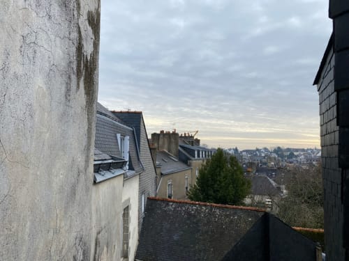 Vannes rooftop view from Le Lien apartment showing historic buildings and cityscape, Brittany France