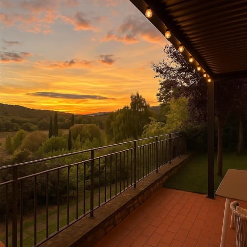 Cognaia Loft terrace at sunset overlooking Tuscan countryside with valley views, Arezzo