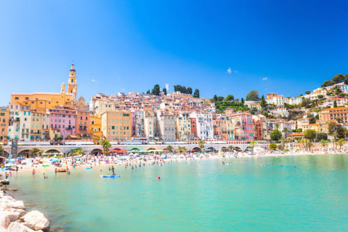 Colorful coastal town with beach and turquoise water, French Riviera near Vence