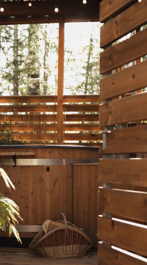 Private outdoor hot tub in wooden lodge, Vosges