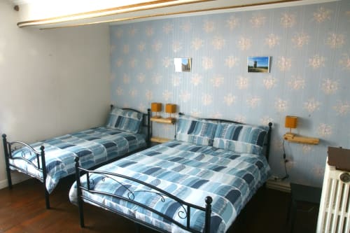 Twin bedroom with blue patterned bedding at Les Gîtes de l'Impériale in Sermizelles, France