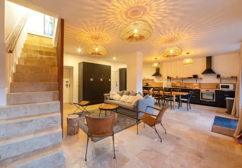 Maison de Sophie cottage open-plan living area with kitchen, dining space, and lounge in Rencurel