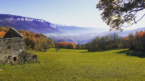 Stone cottage at Maison de Sophie B&B in Rencurel with Alpine mountain views and autumn foliage