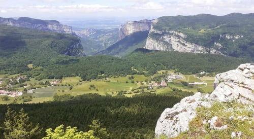 Maison de Sophie B&B overlooks lush Alpine valley with dramatic limestone cliffs in Rencurel, France