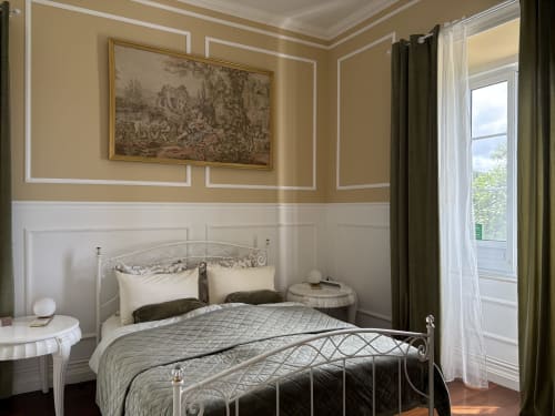 Elegant bedroom at Villa Várzea in Várzea with ornate iron bed, cream bedding, and classic décor