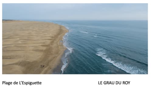 Aerial view of L'Espiguette beach with sandy shore and Atlantic waves near Le Grau du Roy