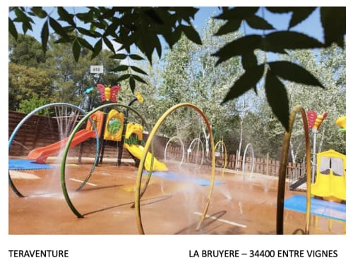 Colorful playground with arches and slides at Teraventure, La Bruyère, Entre Vignes near Boissieres
