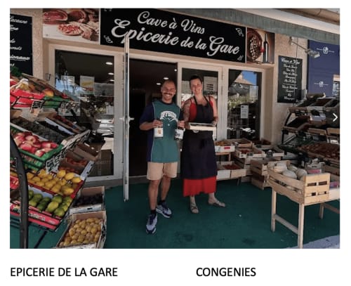 Two shopkeepers at Epicerie de la Gare, a delicatessen in Boissières offering fresh produce and local provisions