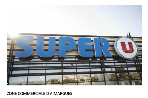 Super U supermarket storefront in Aimargues commercial zone near Boissières