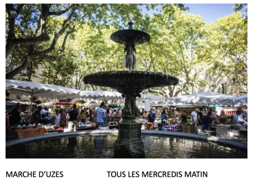 Marché d'Uzes market fountain with vendors and crowds, Wednesday mornings in Boissieres