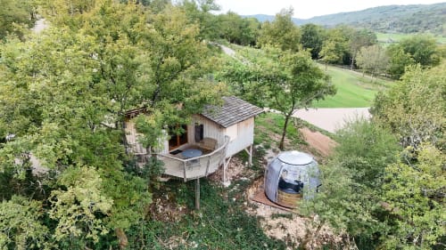Treehouse cabin with spa pod nestled among trees overlooking Serrières-sur-Ain valley and river