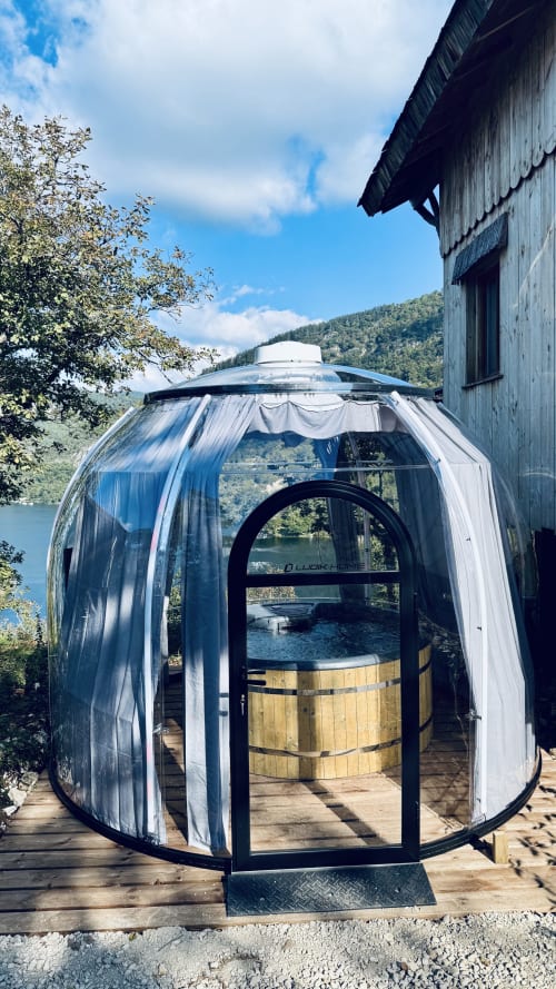 Modern geodesic dome lodge with spa at Cabanes et lodges du Belvédère, overlooking Ain River and mountains