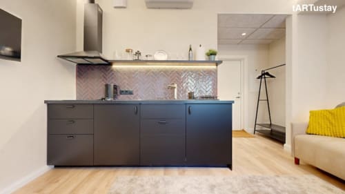 Modern kitchenette with stylish herringbone backsplash. Ralf Sannikov's studio in Tartu city center. Walk to Town Hall Square, RIMI & MyFitness