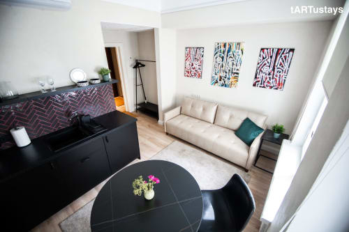 Bird's-eye view of Ralf Sannikov's studio with original art collection. Modern Tartu apartment near Town Hall Square, walking distance to RIMI & MyFitness
