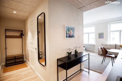Welcoming entryway with clothes rack & Kairo art. Central Tartu near Raekoja Square, RIMI & MyFitness next door