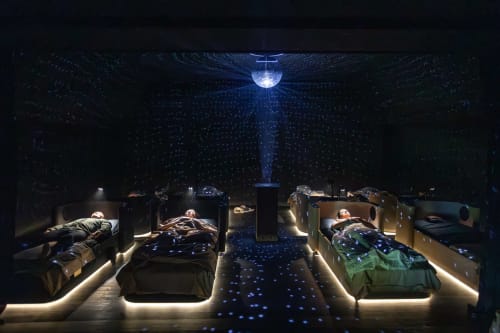 Maison de Sophie's enchanting bedroom with glowing beds under starlit ceiling in Rencurel