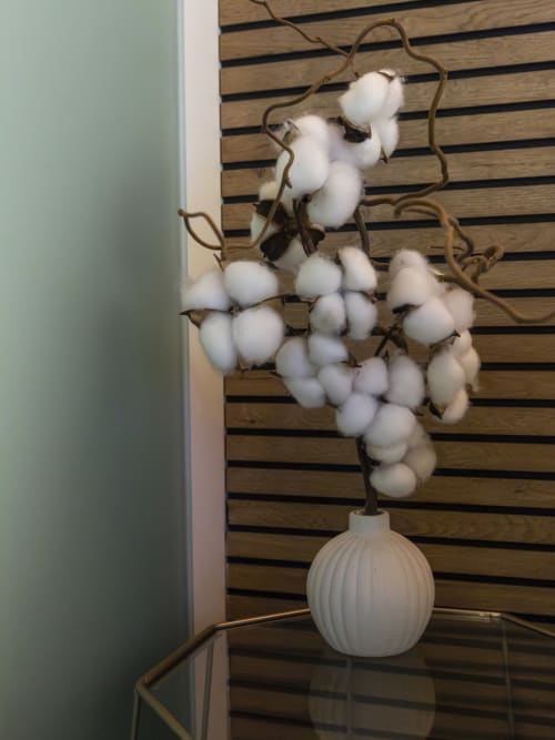 White cotton branch in ceramic vase at YOUnique Boutique Rooms Milano, decorative room accent