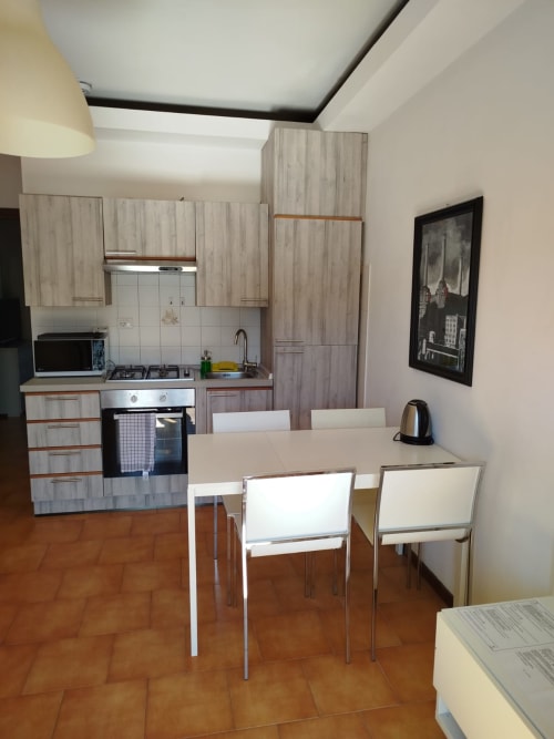 Carducci Apartment kitchen and dining area at THE V Collection, Turate with modern furnishings and appliances
