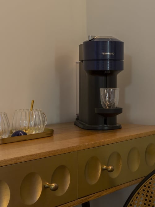 Nespresso Vertuo coffee machine on wooden desk in YOUnique Boutique hotel room, Milano