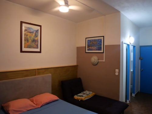 Cozy studio bedroom at Studio Face Marina in Saint-François with bed, artwork, and modern amenities