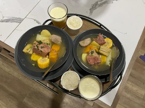 Two bowls of hearty beef stew with potatoes and corn at Chalets Vistas del Poas, Heredia Costa Rica