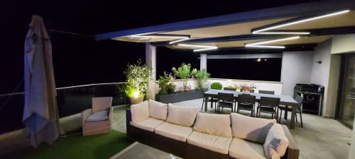 Corse et Zen rooftop terrace at night with lounge seating, dining area, and Mediterranean views in Taglio Isolaccio