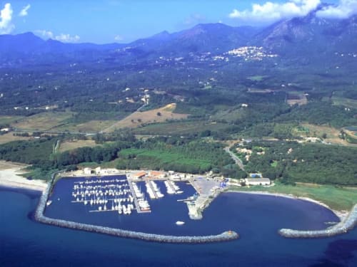 Aerial view of marina with sailboats, coastal resort Corse et Zen, Taglio Isolaccio, Corsica mountains