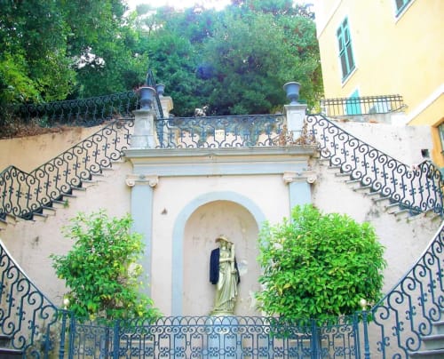 Grand staircase with ornate wrought iron railings at Corse et Zen hotel in Taglio Isolaccio, Corsica