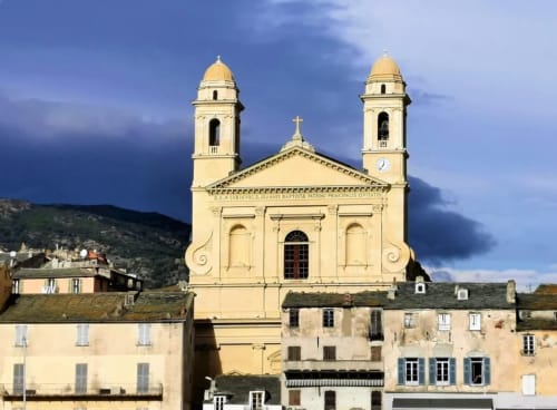 Yellow church with twin domes overlooks Taglio Isolaccio, Corsica near Corse et Zen hotel