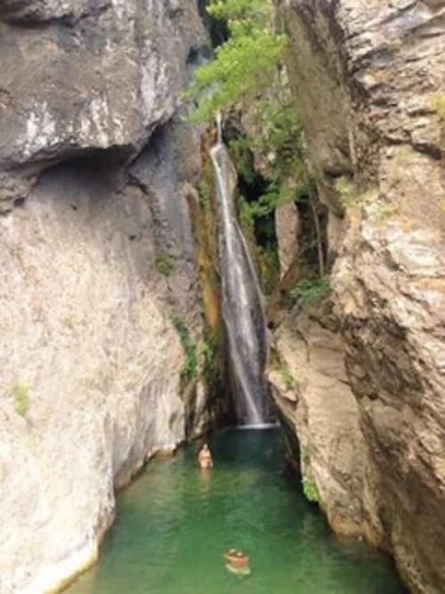 Narrow canyon waterfall with emerald pool at Corse et Zen, Taglio Isolaccio, Corsica
