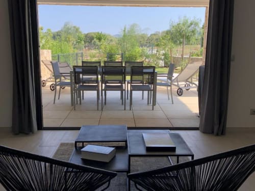View from Excellence Handset cottage at Sweet Holiday in Porto-Vecchio, showing patio doors opening to garden with outdoor