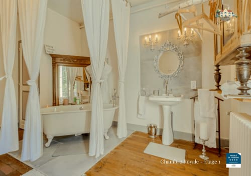 Elegant bathroom in Chambre Royale at Baccara Lodge, Arengosse, with clawfoot tub and pedestal sink