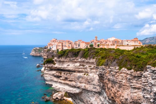 Sweet Holiday hotel overlooking dramatic coastal cliffs and turquoise Mediterranean waters in Porto-Vecchio, France