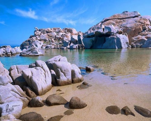 Granite boulders and turquoise waters at Sweet Holiday beach in Porto-Vecchio, Corsica