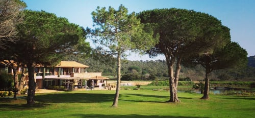 Sweet Holiday hotel in Porto-Vecchio with manicured gardens, terracotta villa, mature trees, and tranquil pond