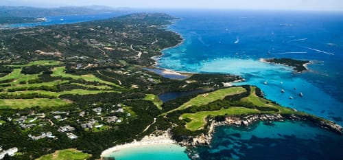 Aerial view of Sweet Holiday near Porto-Vecchio with turquoise beaches, forested coastline, and sailboats in crystal-clear