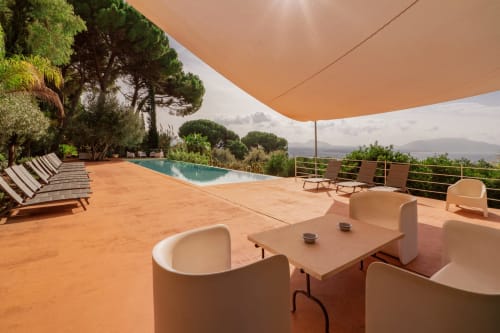 Case Zucco terrace with infinity pool, Mediterranean views, and cream furnishings in Terrasini, Sicily