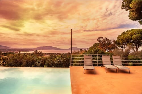Case Zucco poolside terrace at sunset with lounge chairs overlooking Terrasini coast, Sicily