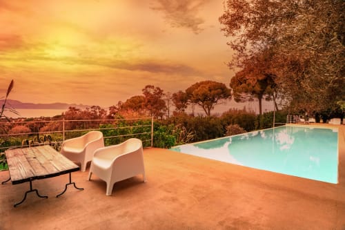 Case Zucco B&B terrace in Terrasini with infinity pool, sunset view, and sea overlook at dusk