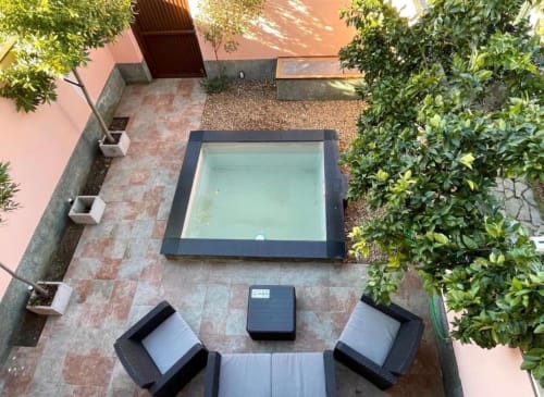 Vista aérea de la cabaña Gestyp-AT en Mérida con piscina, áreas de descanso y vegetación exuberante