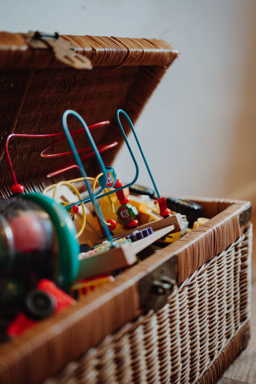 Colorful wooden toy in wicker basket at Baccara Lodge, Arengosse