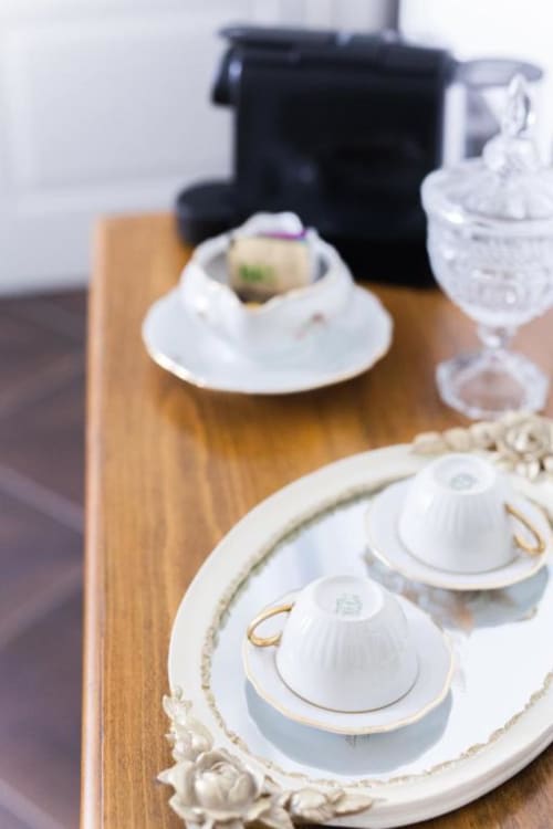 Elegant table setting at Alessia's Place Como with fine dinnerware, glasses, and gourmet dessert on wooden surface