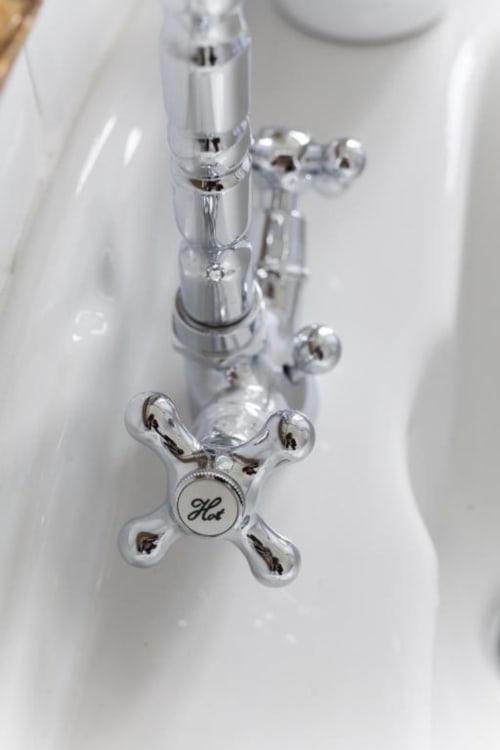 Chrome bathroom faucet with hot water control at Alessia's Place bed and breakfast in Como, Italy