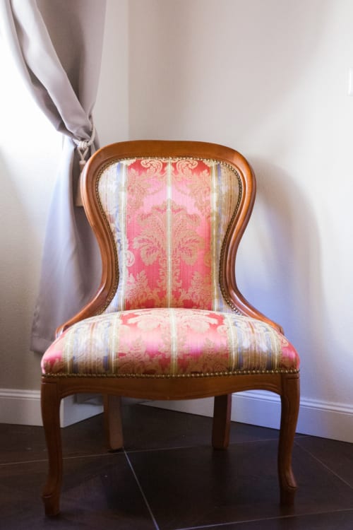 Elegant wooden chair with pink damask upholstery in Suite 2 at Alessia's Place, Como
