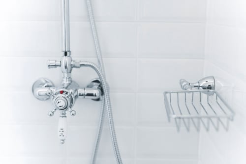 Chrome shower fixtures and basket in Suite 7 bathroom at Alessia's Place B&B, Como