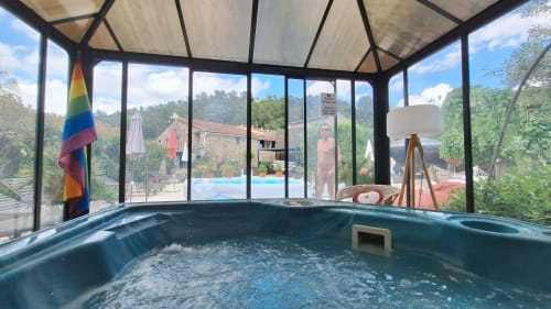 Indoor hot tub at La Bergerie Du Moulin guesthouse in Taradeau, France with poolside views