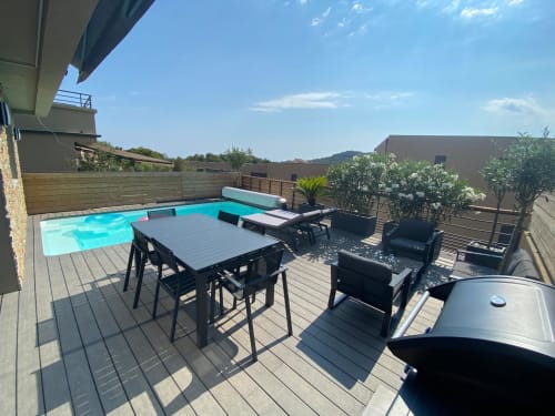 Villa Stella terrace with heated pool, dining table, lounge seating and mountain views, Favone Corsica, managed by Corsu di Core conciergerie