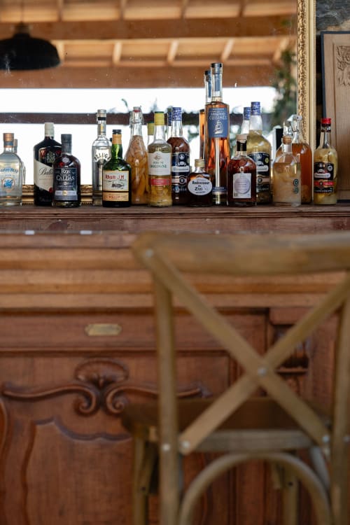 Elegantly displayed spirits and liqueurs at Domaine du Tertre Ychot bar in Dol de Bretagne