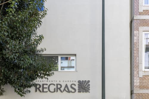 Regras Apartments & Garden Porto facade with climbing ivy and window detail